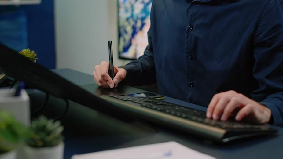 Artist utilizing a digital drawing tablet